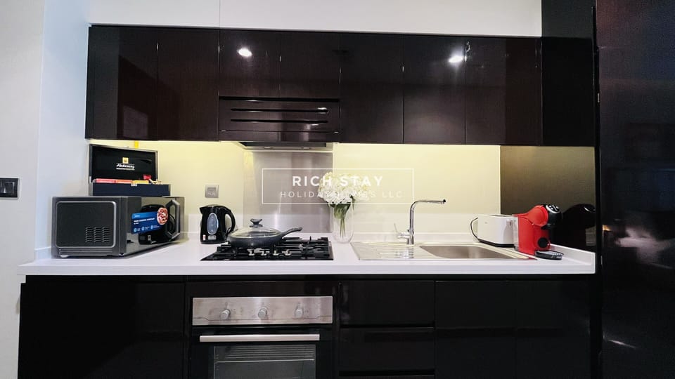 KITCHEN AREA WITH FITTED APPLIANCES