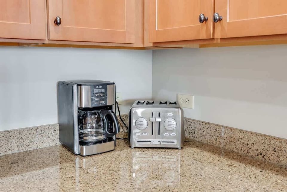 - Start your day right with a drip coffee maker ready for your morning brew routine - Stainless steel toaster with 4 slots handles busy breakfasts with ease and speed - Set on polished granite counters, this compact station blends style and function