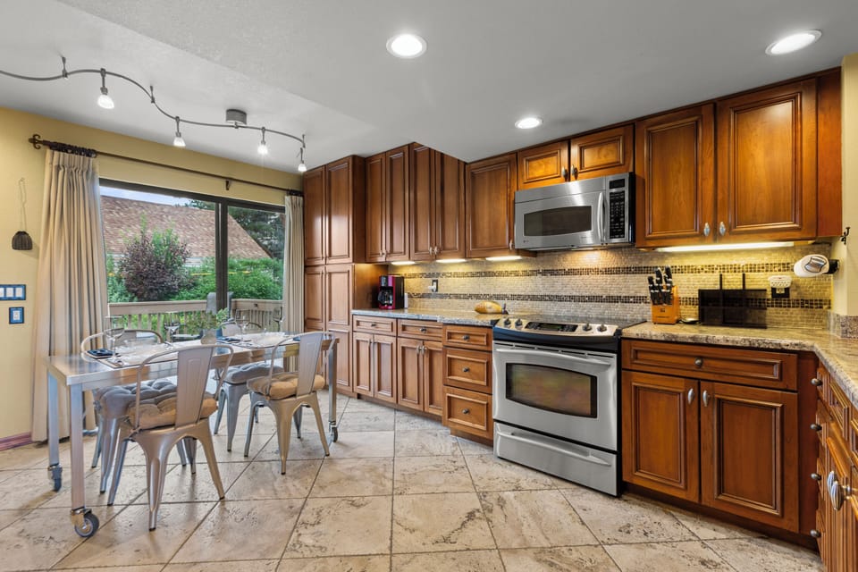 The kitchen has a dining table with seating for 4 guests.