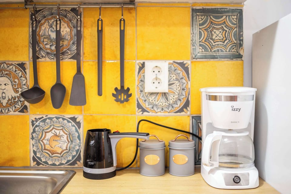 Coffee Station with Essentials for Your Morning Brew
Start your mornings right with a dedicated coffee corner, complete with kettle, coffee maker, and mugs.