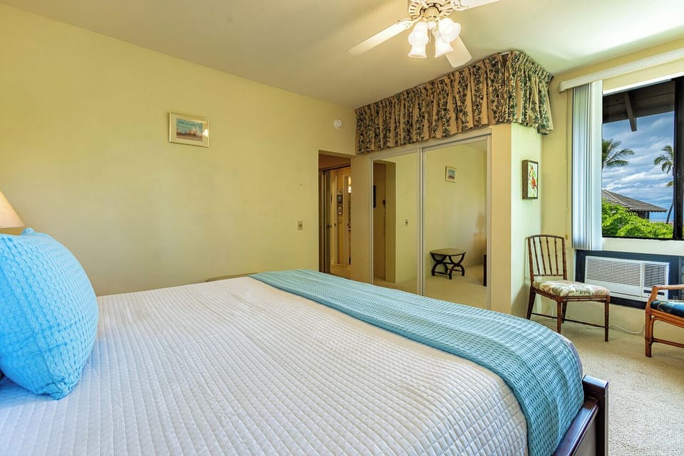 There is a wall AC unit in the bedroom