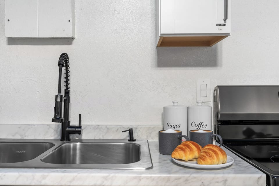 Stylish space with modern kitchen and coffee bar.