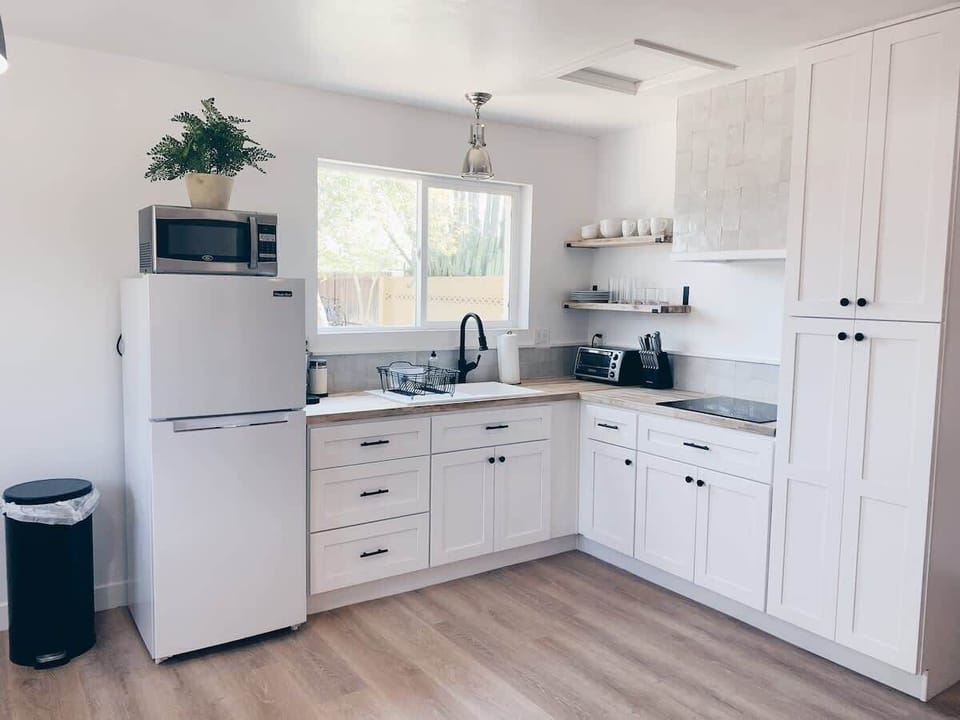 Prepare delicious meals in your fully equipped kitchen, designed for your culinary convenience.