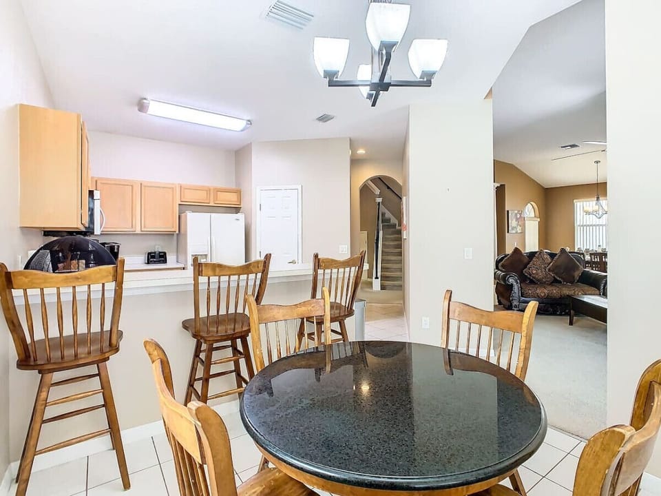 Elegant dining area with ample seating, perfect for enjoying meals with family and friends.