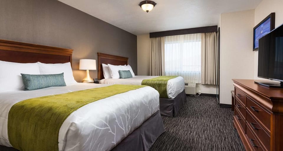 Settle in with comfy queens and easy in-room entertainment.