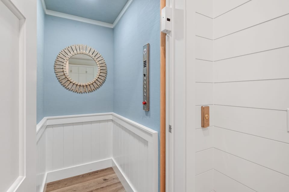 The elevator services all floors, including the garage, except for the tower.