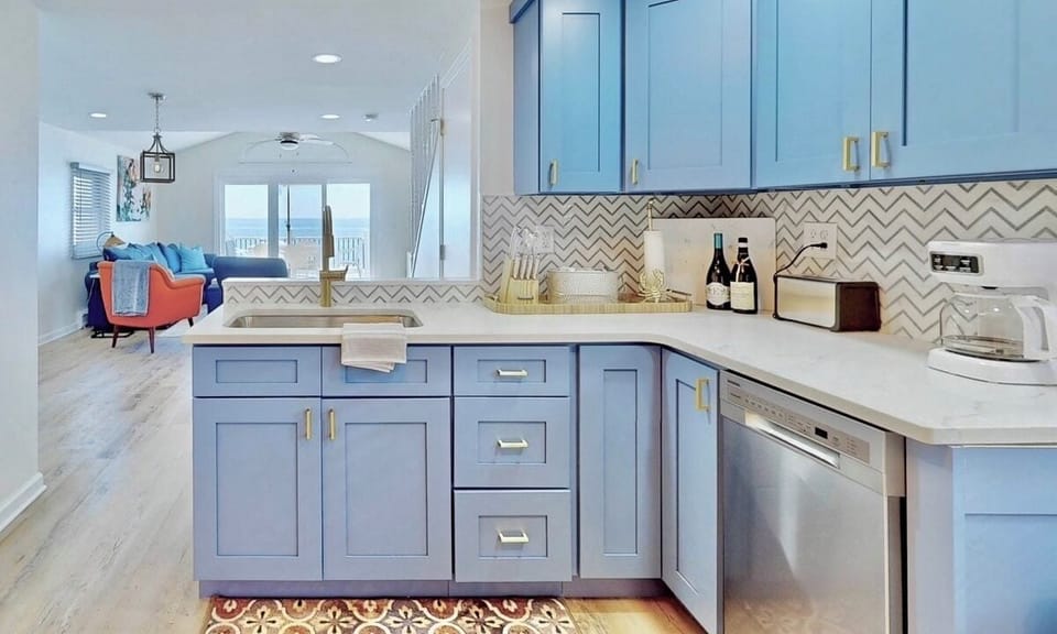 Kitchen with view of living area and deck
