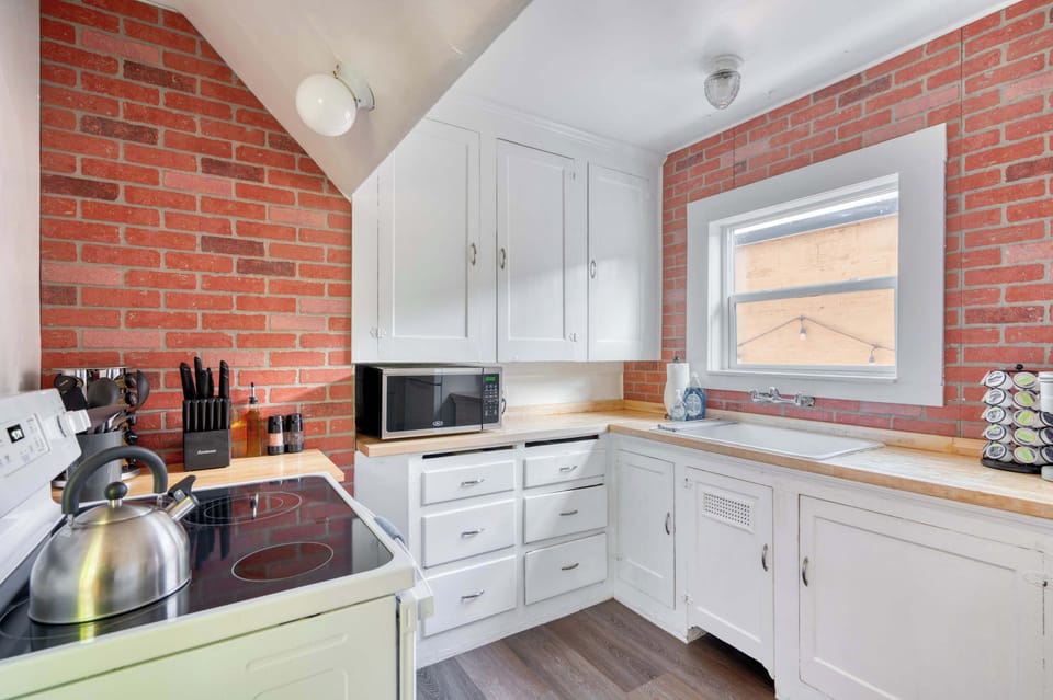 Kitchen counter and brick backsplash.