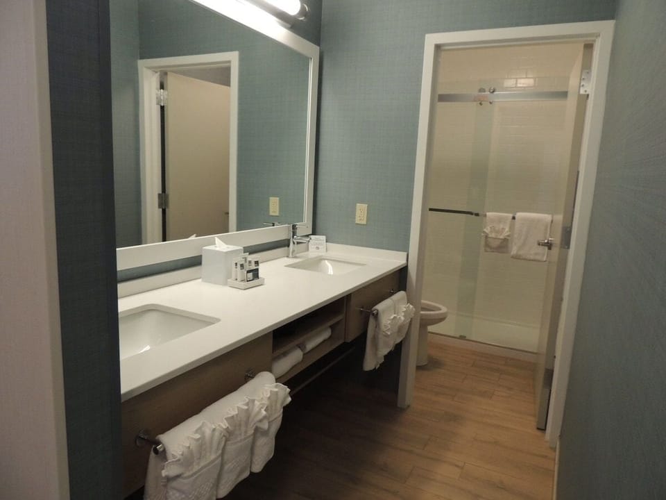 Refresh effortlessly with double sinks and a spotless vanity.