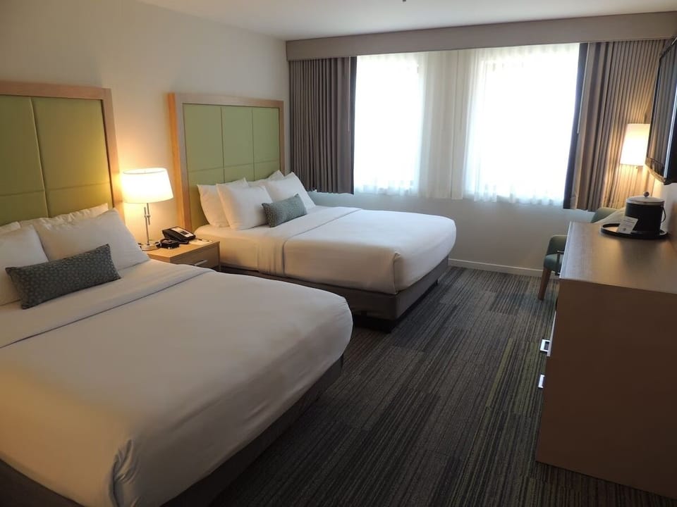 Spread out with two roomy beds and a sunlit layout.