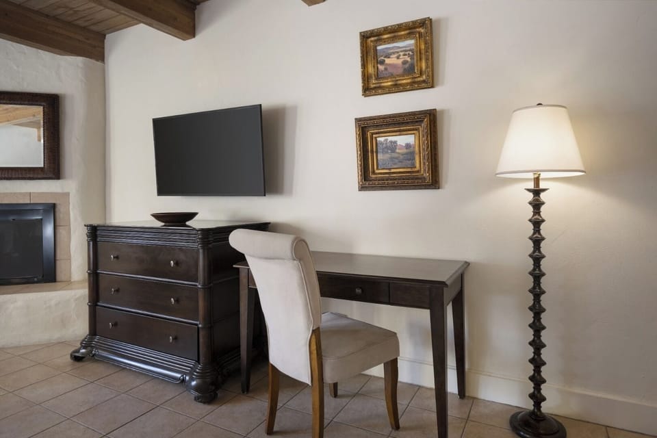 Catch up on emails at a quiet desk with warm lighting.