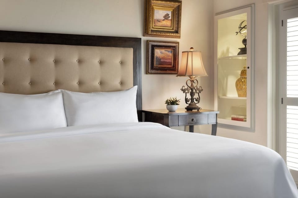 Drift off surrounded by plush pillows, soft light, and calm.