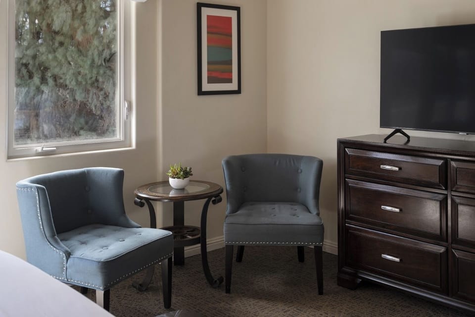 Sip morning coffee in cozy chairs beside the window.