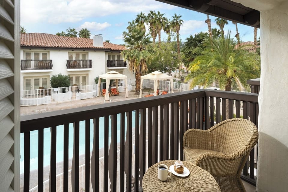 Sip morning coffee on the balcony overlooking the sparkling pool.