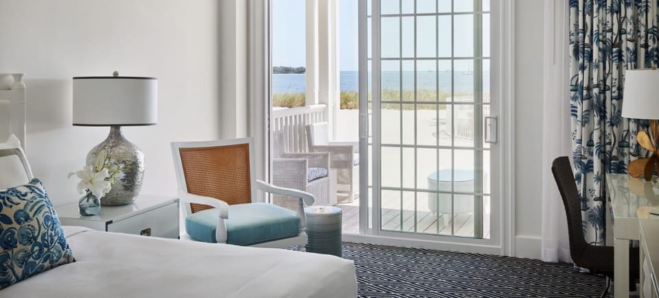 Unwind by the sliding doors as waves glimmer outside.