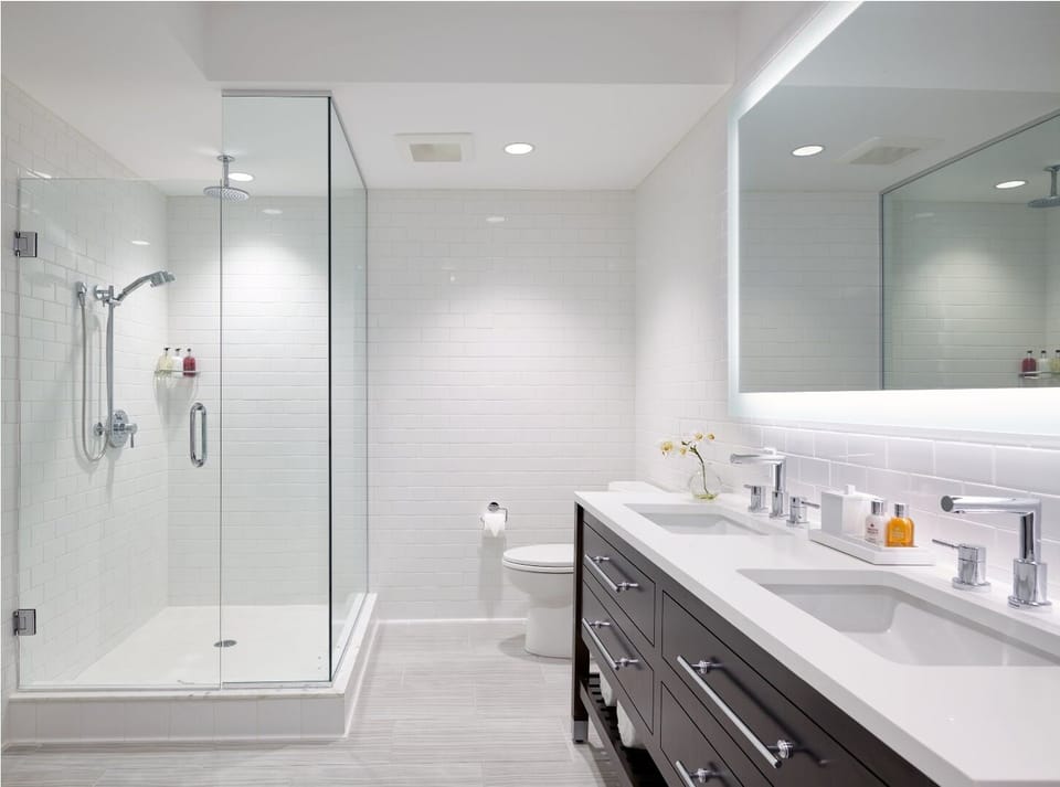 Refresh under a roomy glass shower in spa-like serenity.