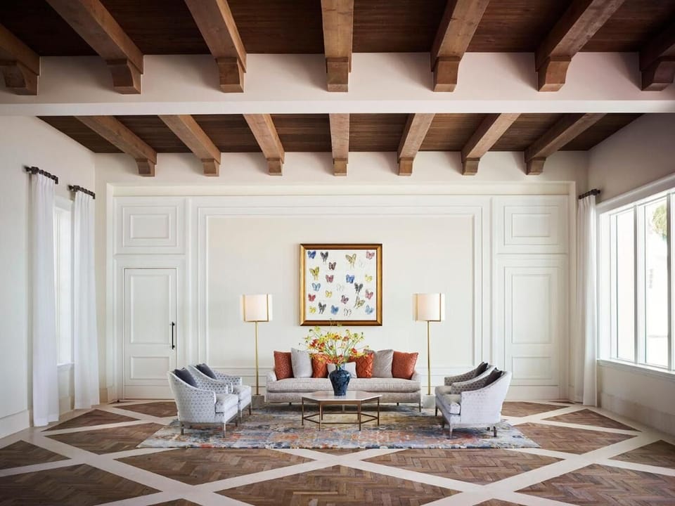 Relax in an airy lounge beneath warm wood-beam ceilings.
