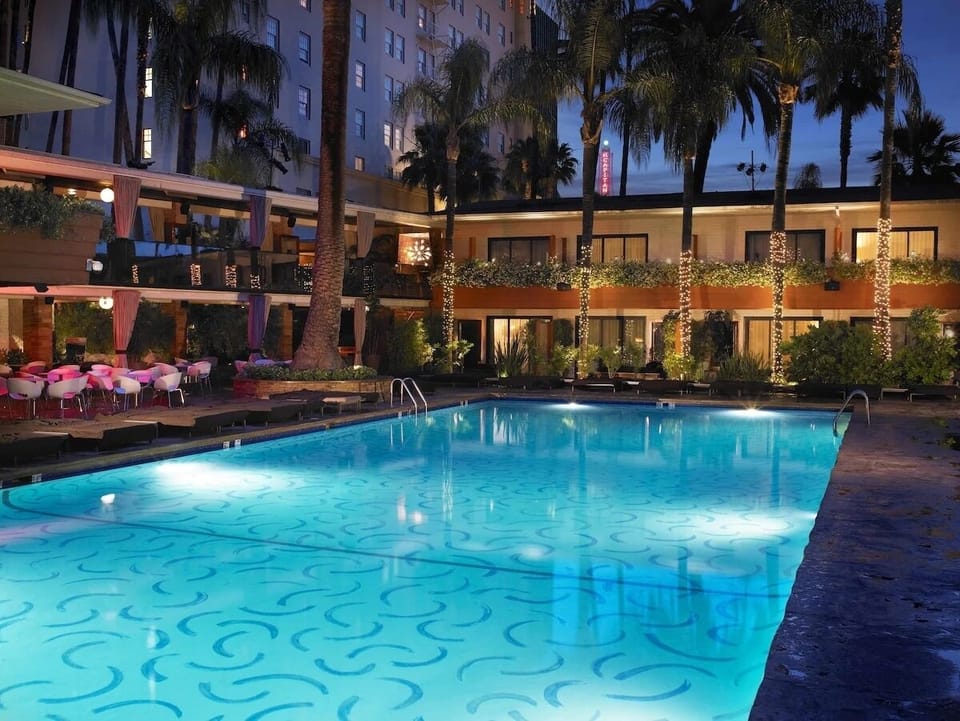 Unwind after dark with a shimmering, lantern-lit pool escape.