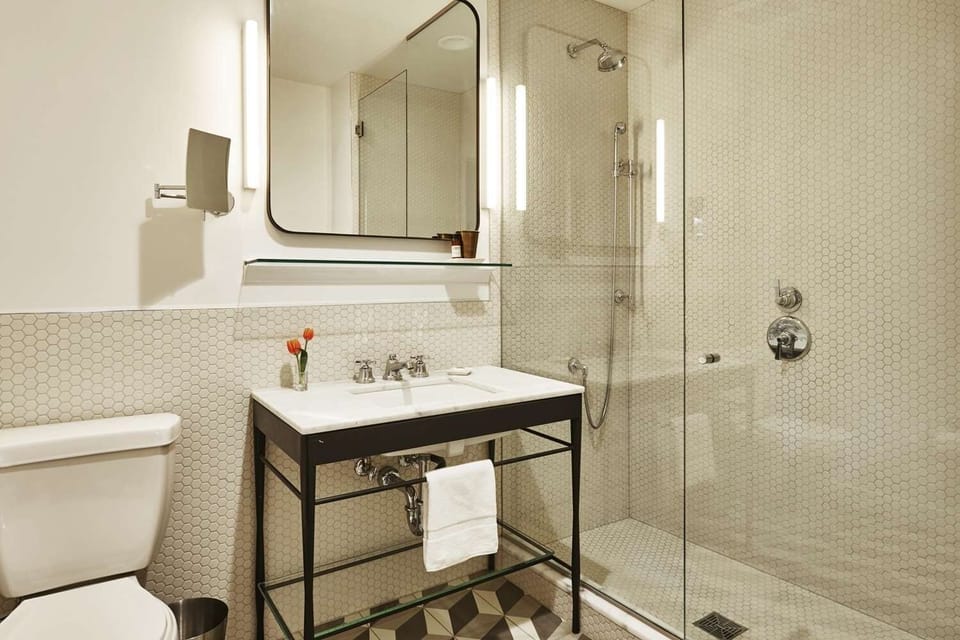 Refresh in a sparkling glass shower with modern fixtures.