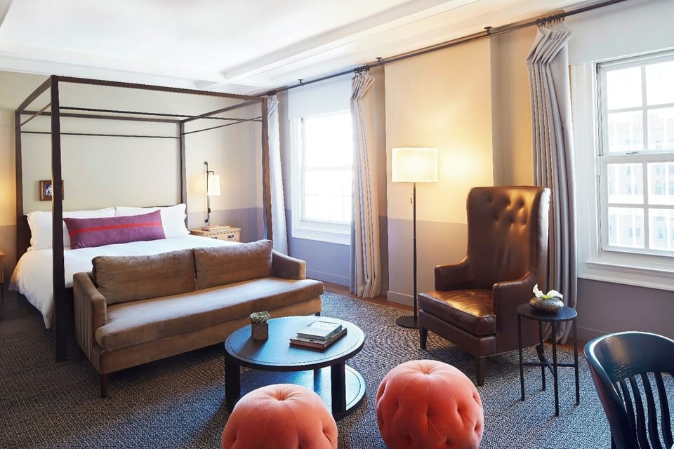Lounge together in a bright sitting area steps from bed.
