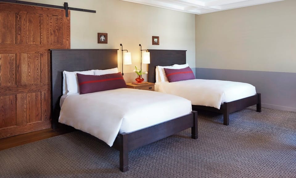 Settle into twin comfort with soft pillows and reading lights