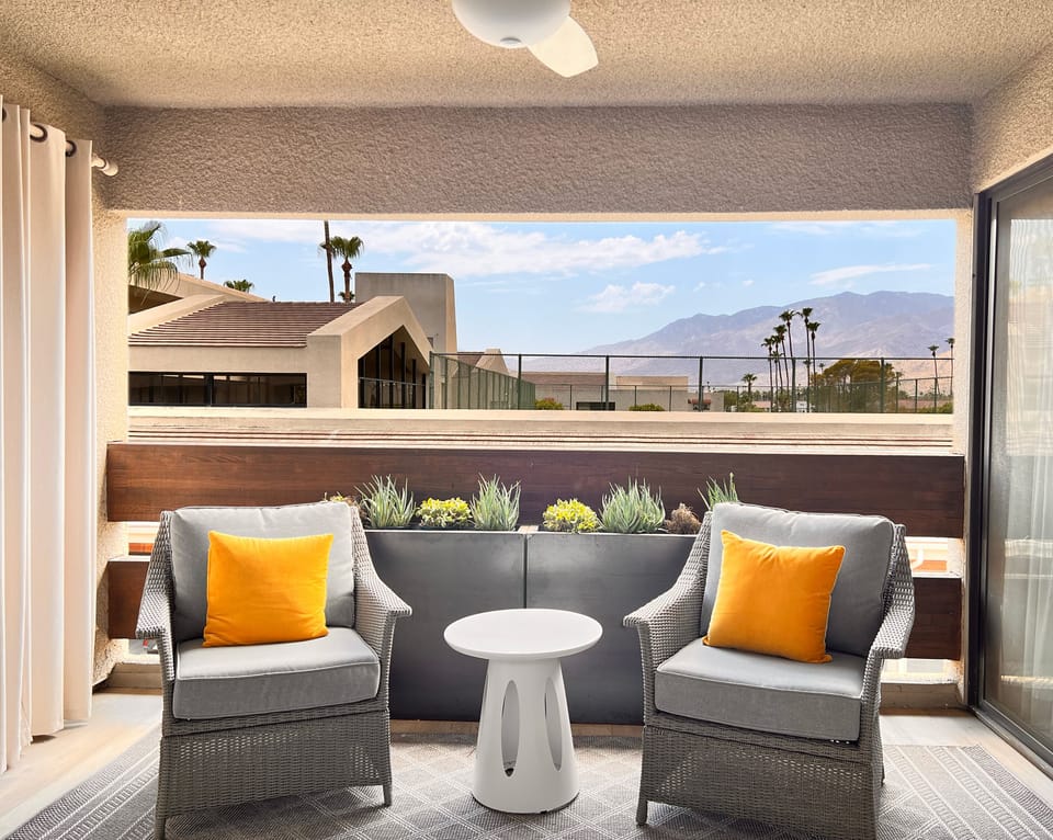 Private balcony with mountain views.