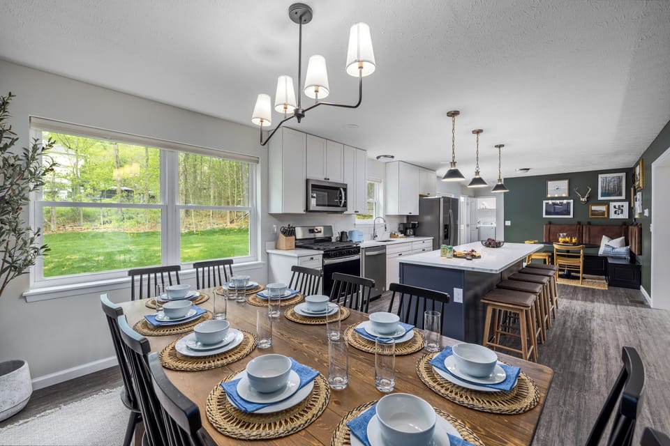 Dining table, with seating for 10 people. Pocono Mountains Family Friendly & Kid Friendly Amenities, Hot Tub, Sauna, Fire Pit, Grill, Game room, Gaming stations, Pool, Ski, Hike