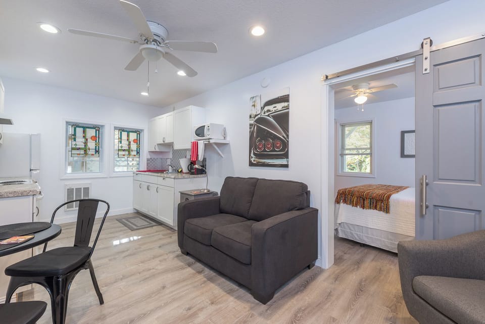 Unwind in the inviting living room, featuring comfortable seating and a warm ambiance, ideal for relaxation after a day of exploration.