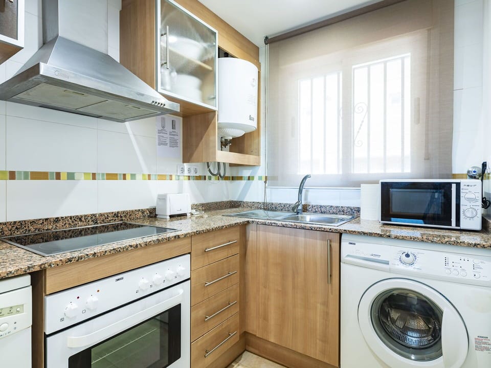 Cabinetry, Property, Clothes Dryer, White, Washing Machine, Countertop, Kitchen Appliance, Laundry Room, Home Appliance, Kitchen Stove