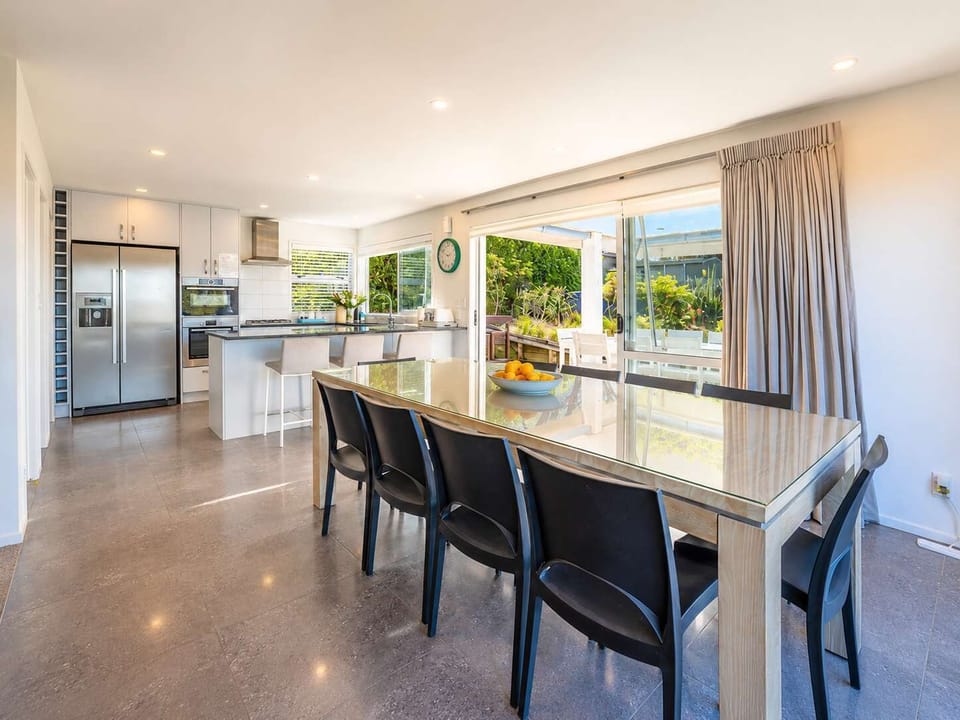Dining Room with Access to Kitchen and Outdoor Dining