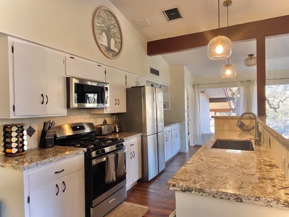 Stainless steel appliances, granite counters, and everything you need to cook.