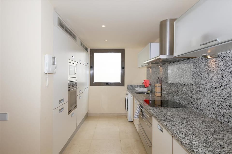 Kitchen in this apartment is fully fitted with quality appliances