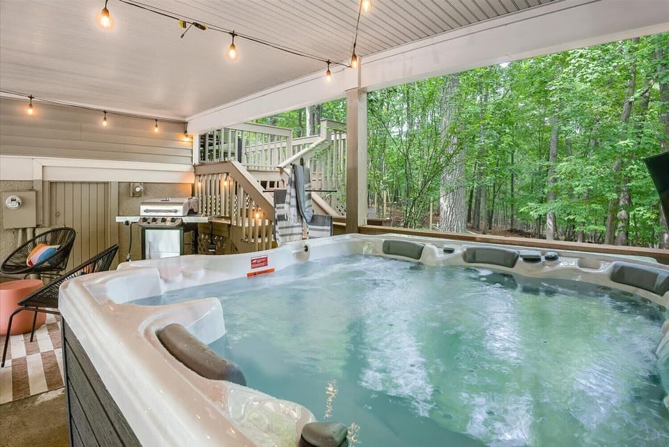 Soak in the hot tub while enjoying the serene natural surroundings