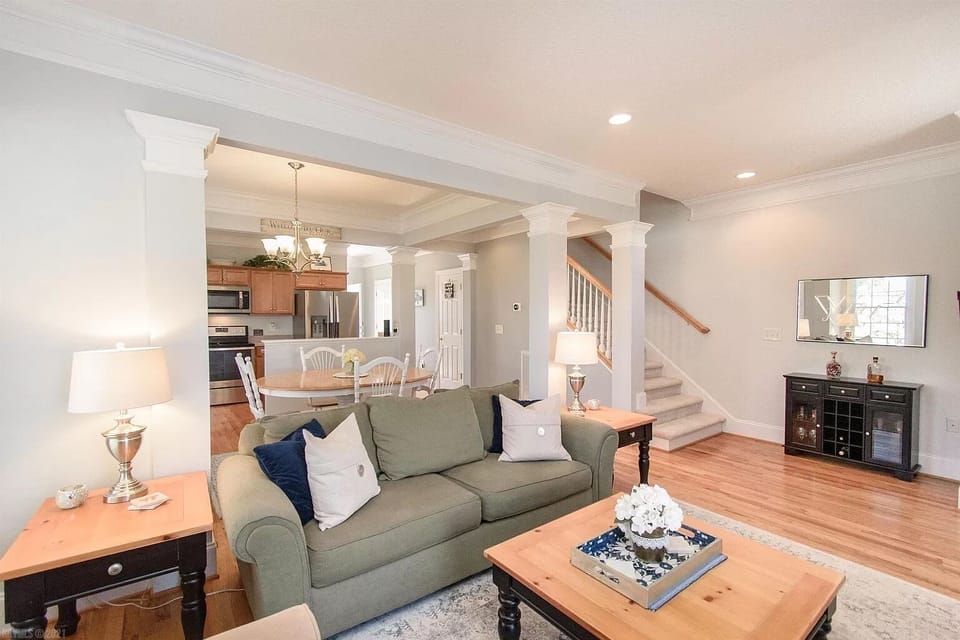 living room, looking into dining room and kitchen area 