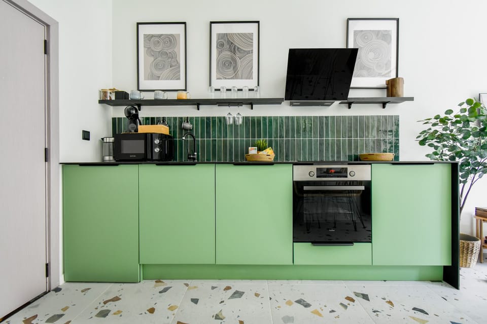 Modern Kitchen: Cook in style with a fully equipped kitchenette featuring modern appliances and sleek design.
