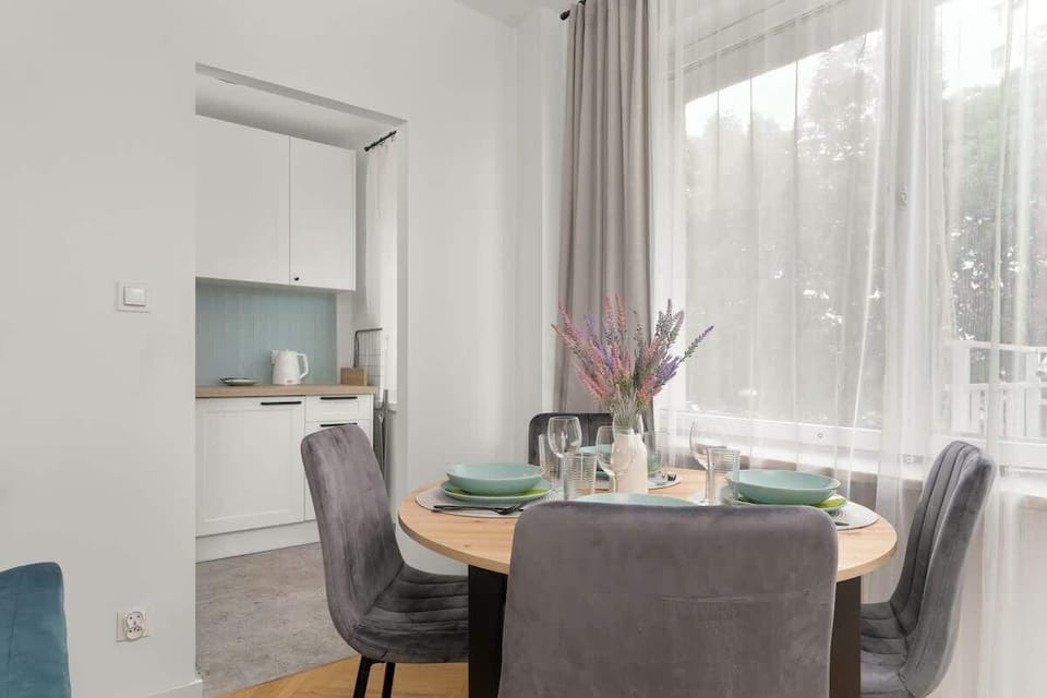 Living room with television and kitchenette.