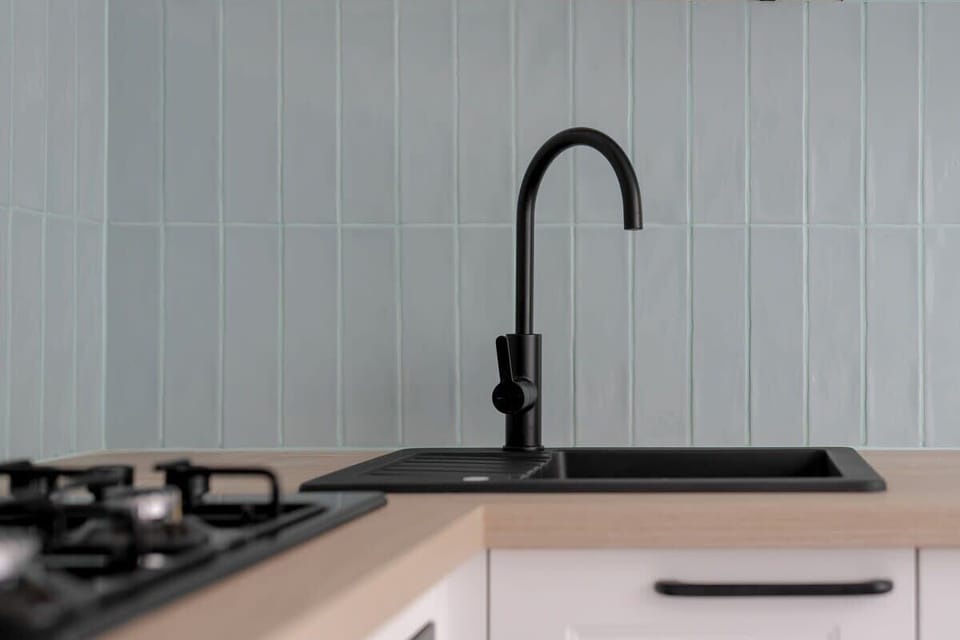 Kitchenette with an oven and a microwave.