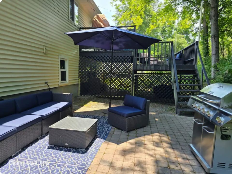 The lower patio area has barbeque and a fire pit for use.