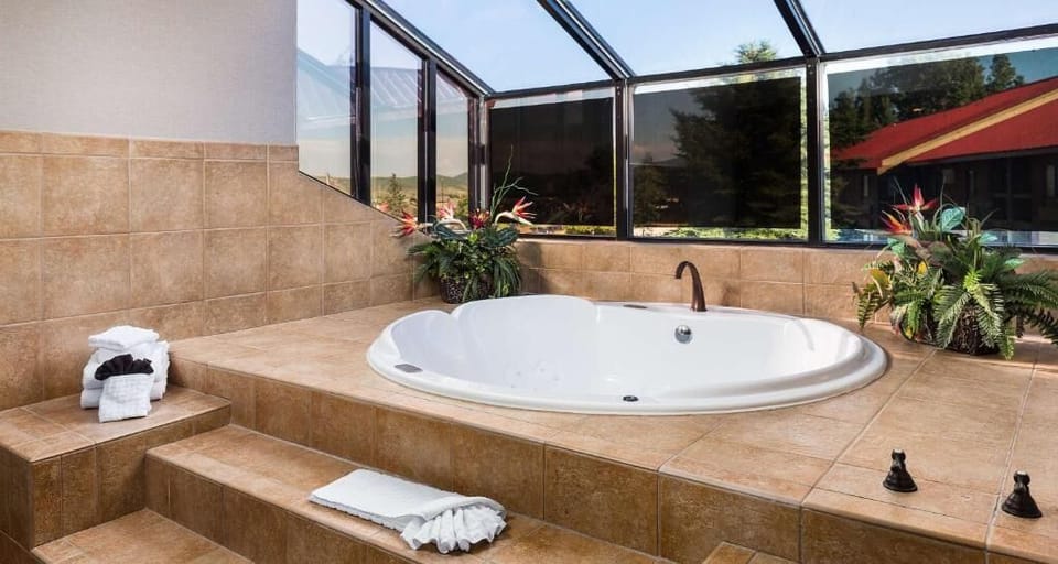 Bask in sunlit serenity while your spa tub bubbles.