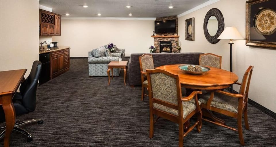 Unwind together in the spacious suite with cozy fireplace glow.