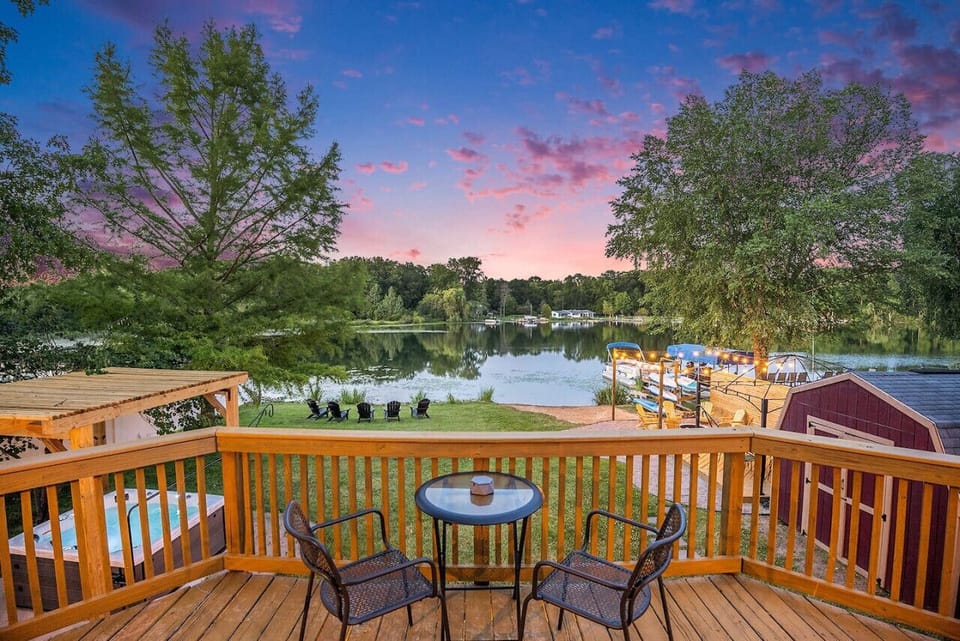 Enjoy a peaceful evening on the deck overlooking the serene lake and nature