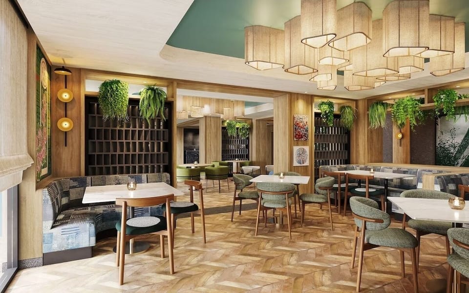 Gather for relaxed meals under soft lighting and lush greenery.