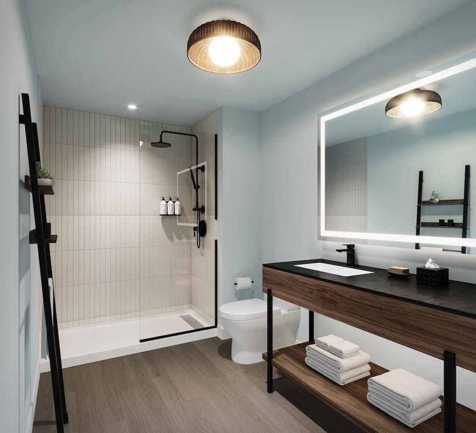 Refresh under a rainfall shower in a spa-like bathroom.