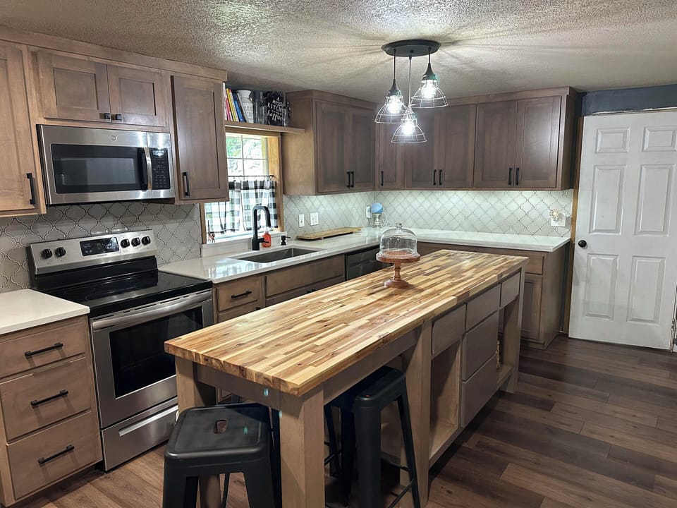 Gourmet kitchen with luxury quartz countertops, extra large cabinets.