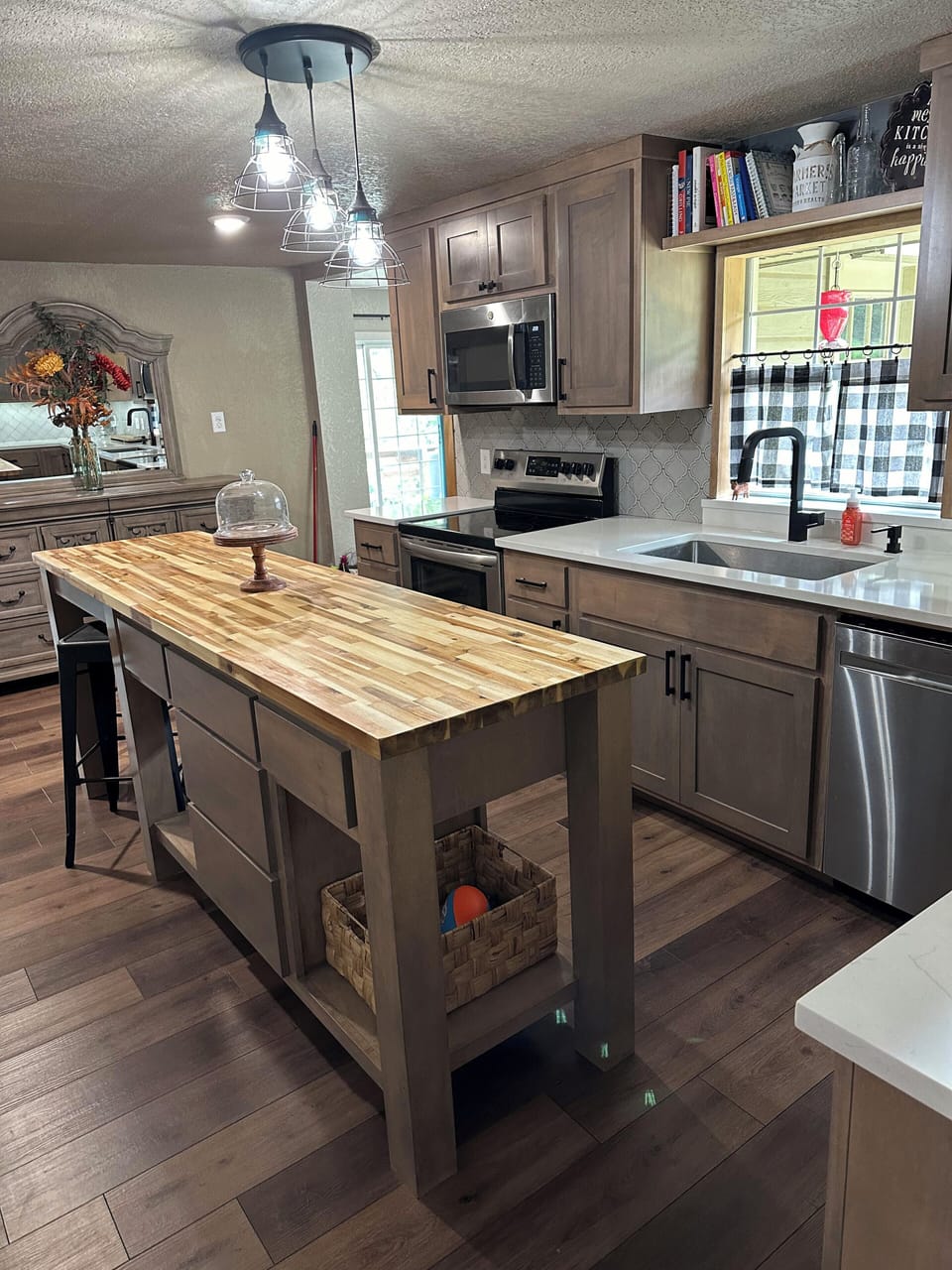 Large butcherblock island and an extra large farmhouse sink.