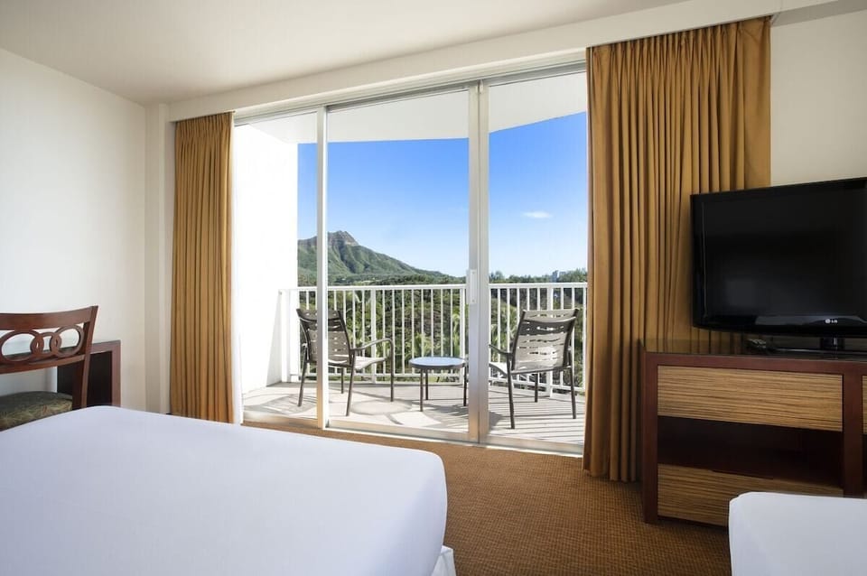 Breathe in mountain and treetop scenery from your private balcony.