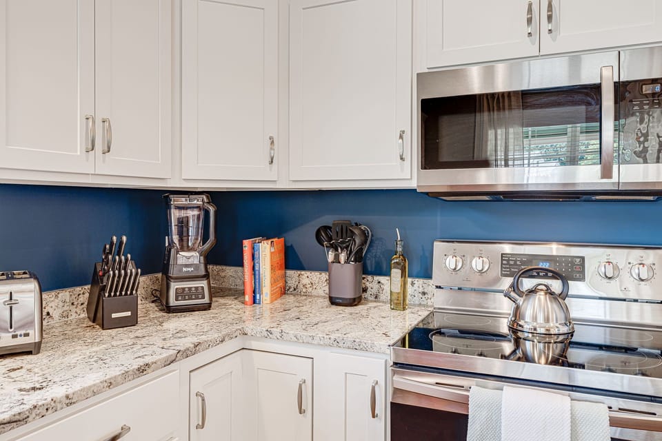 Stainless steel appliances and beautiful countertops give our kitchen an upscale feel.