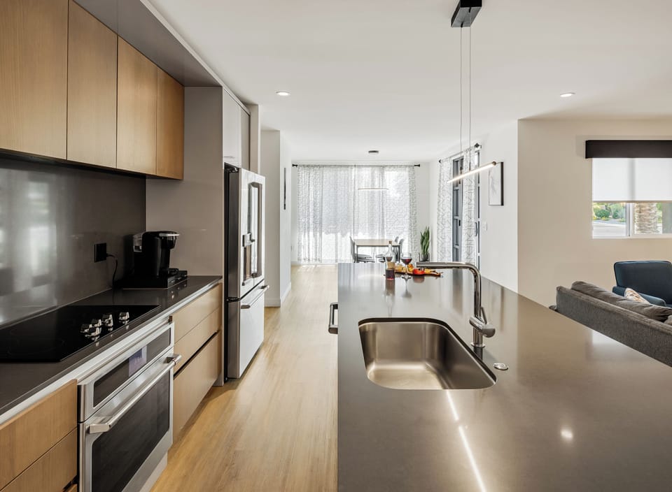 Fully equipped modern kitchen completely stocked with all culinary essentials and includes high-end Cafe stainless steel appliances.