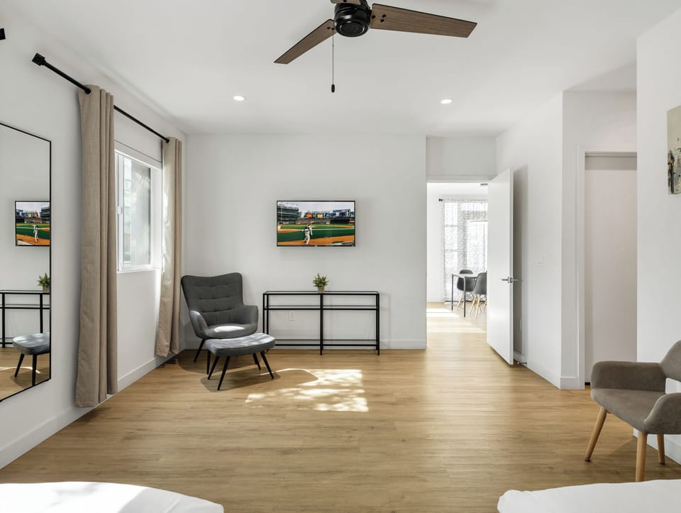 Primary Bedroom featuring 2 Queen Beds, a Smart TV and an ensuite primary bathroom.