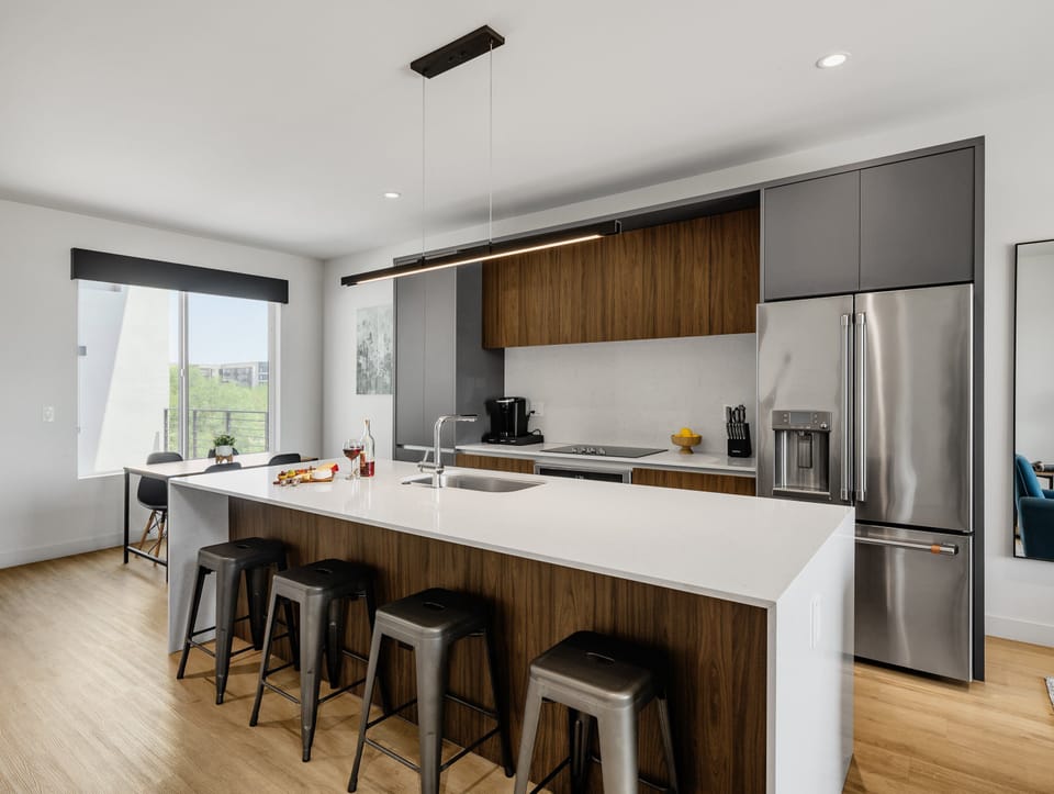 1st Floor: Fully equipped modern kitchen completely stocked with all culinary essentials and includes high-end Cafe stainless steel appliances.